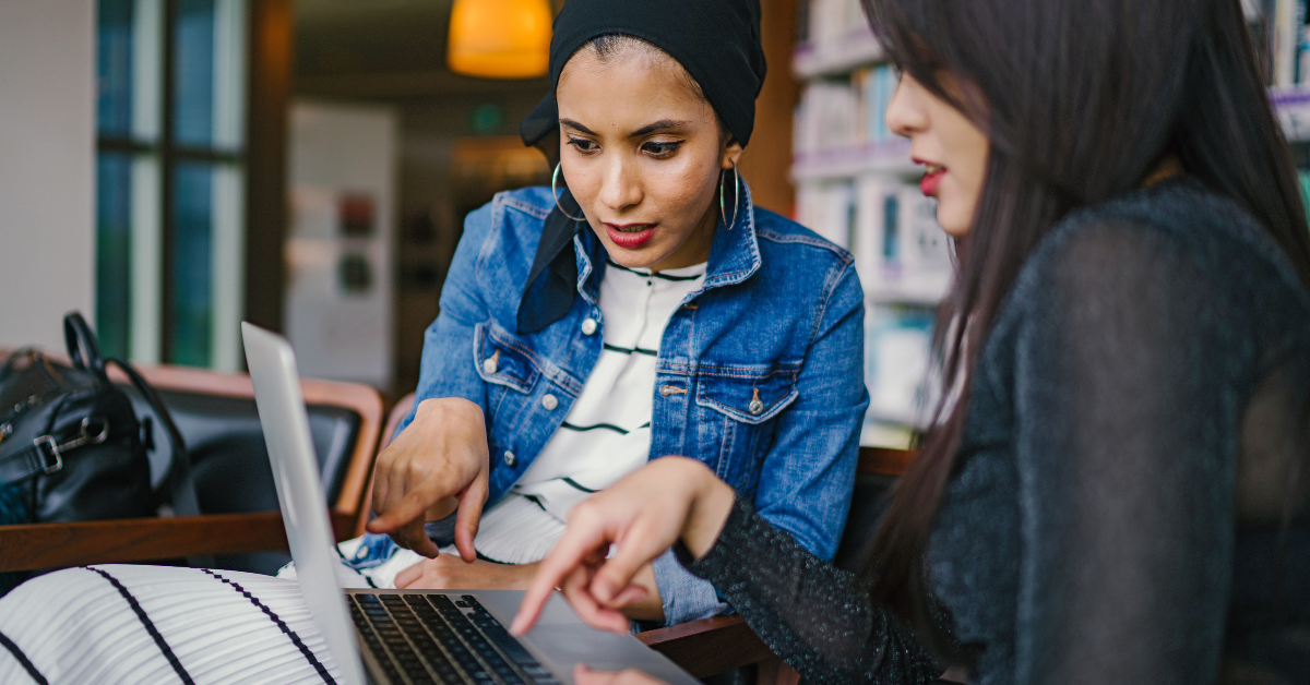 Two women using ChatGPT for small business on laptop 