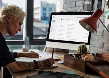 Women writing email marketing plan for her small business