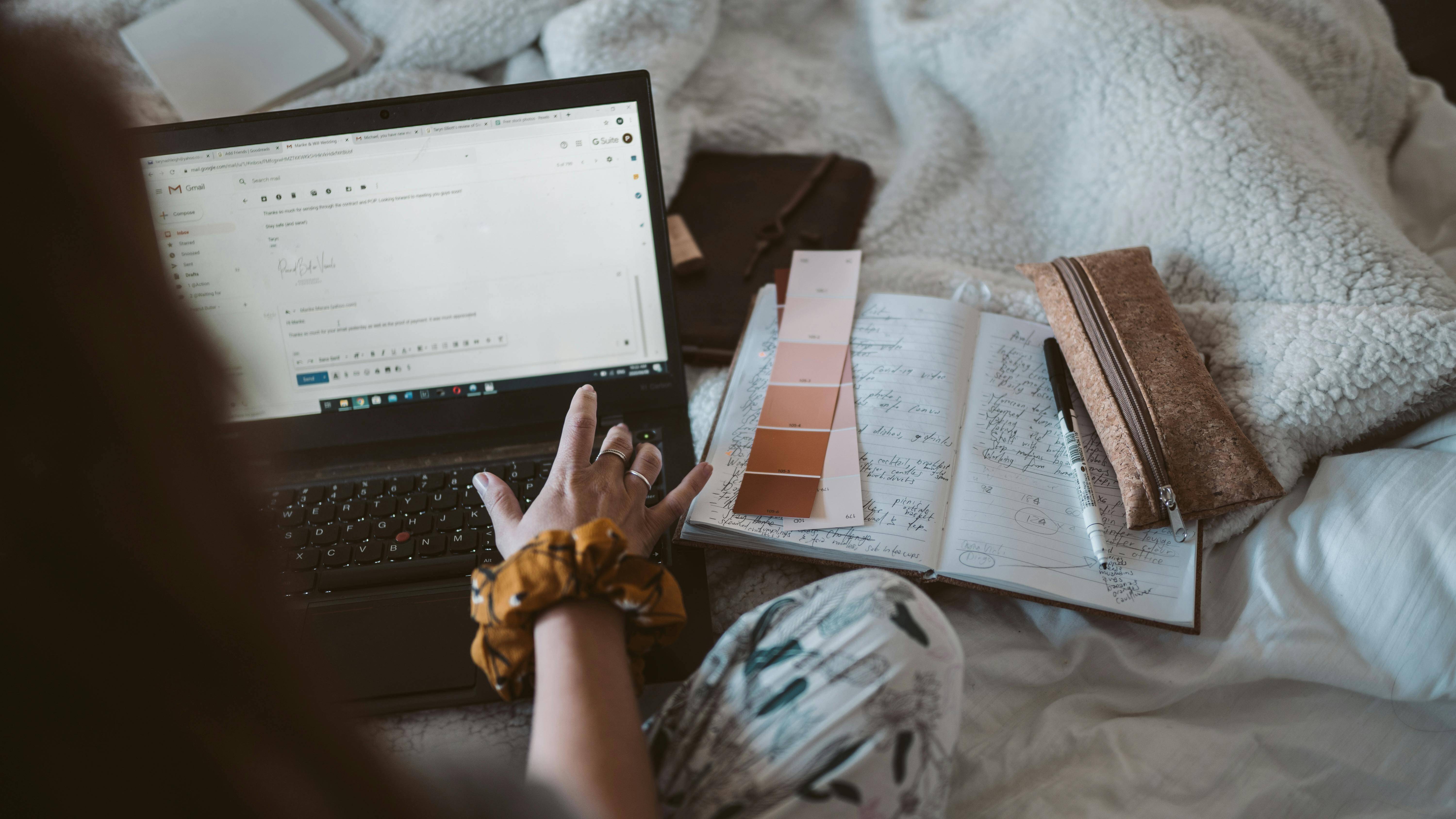 Women typing meeting confirmation email to client